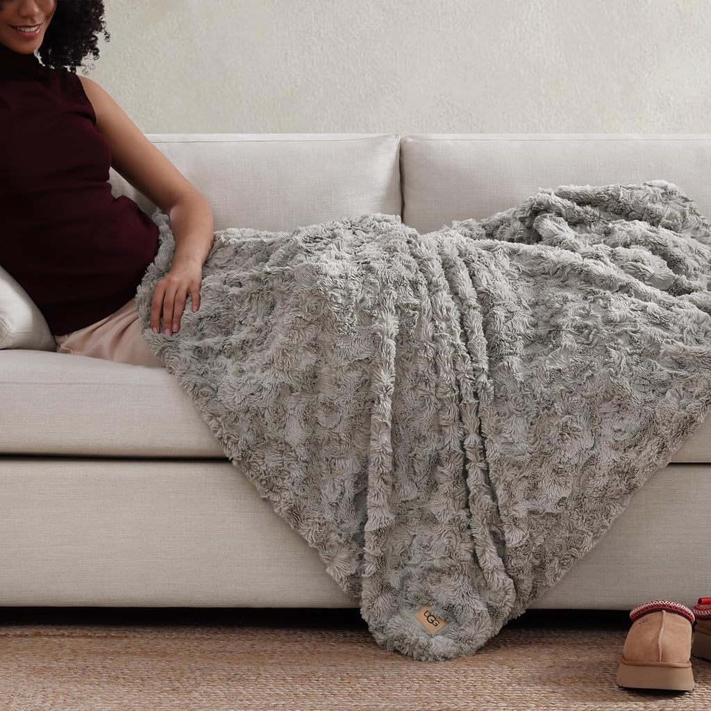 UGG Adalee Faux Fur Throw Blanket  ($60, originally $108)
If you've ever worn UGG boots, you can probably imagine how cozy this blanket feels. It's the ultimate holiday gift for a loved one or, let's be honest, yourself (no judgment — I'm this close to adding it to my cart).