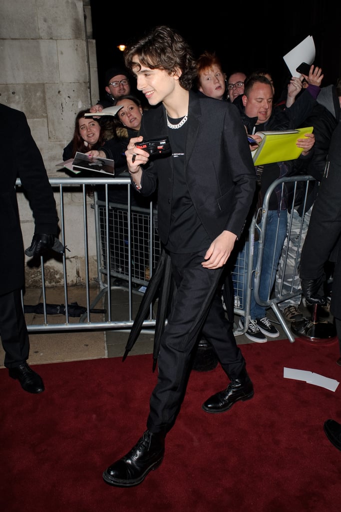 Timothée accessorised his black suit with a chain-link necklace at a pre-BAFTA party in 2019.