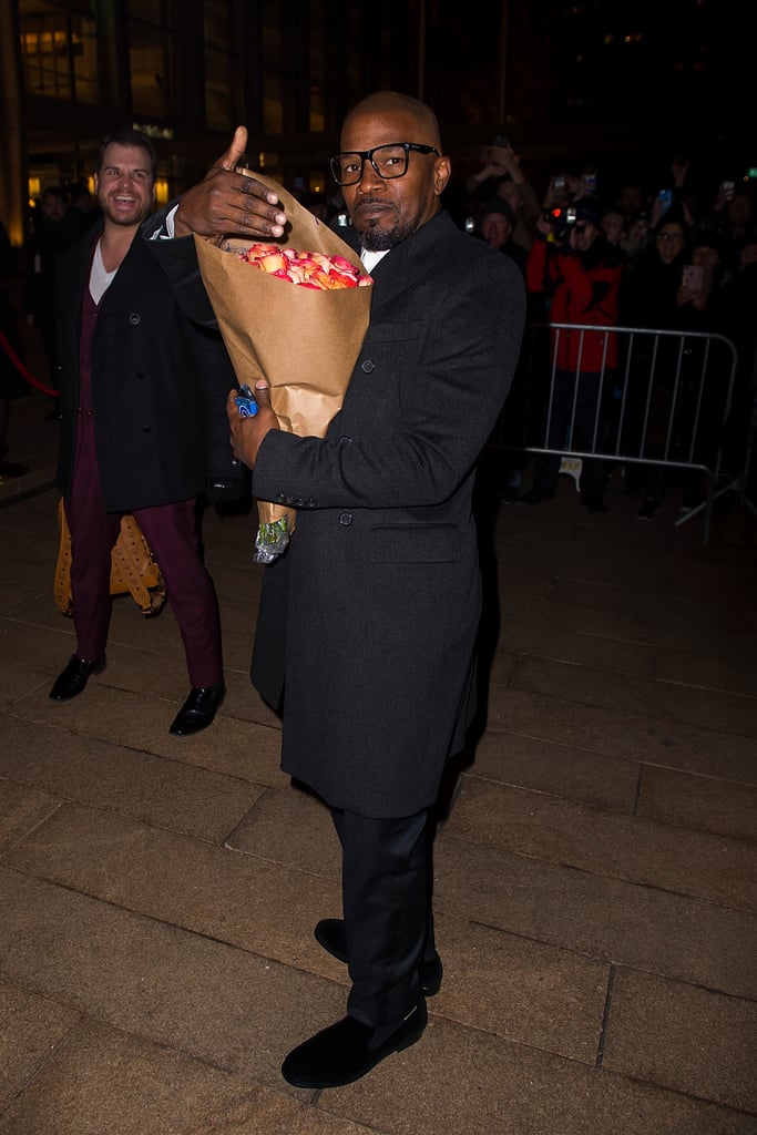 Jamie Foxx arrived carrying flowers for his daughter Corinne, who walked in the show.