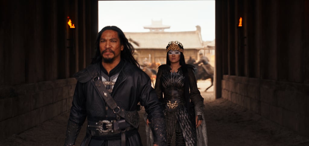 While the 1998 film was referenced in the new movie, it wasn't followed as closely as some may assume. "We weren't really illustrating the original because that exists in its own right," she said. "There were key frames and images in the animation that informed some of the characters, but the makeup approach is not so much derivative, but more of a nod in the direction of the heightened color palette and the brightness that you get with the animation."
To pay homage to the original film, director Niki Caro included a small detail that will make fans happy — if they catch it.
"We had Ming-Na Wen, who was the original voice of Mulan in the animation part one and two, do a cameo in our film," said Kum. "When you see the imperial scene where Mulan is being presented to the emperor, you see this beautiful woman come out and what is really quite lovely is it's almost like the voice of Mulan handing over the mantle to the new Mulan."