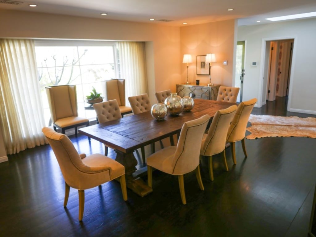 The dining room is situated next to a massive window for plenty of light. 
Source: Sotheby's Realty