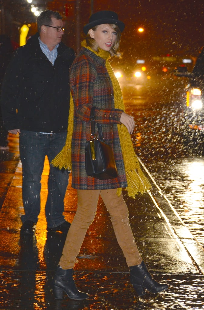 Taylor battled the snow (or itty-bitty flurries, rather) in a plaid Free People cocoon coat.