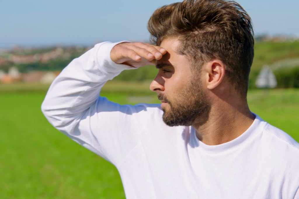 Pondering life, Efron dramatically stares off into the countryside of France.
