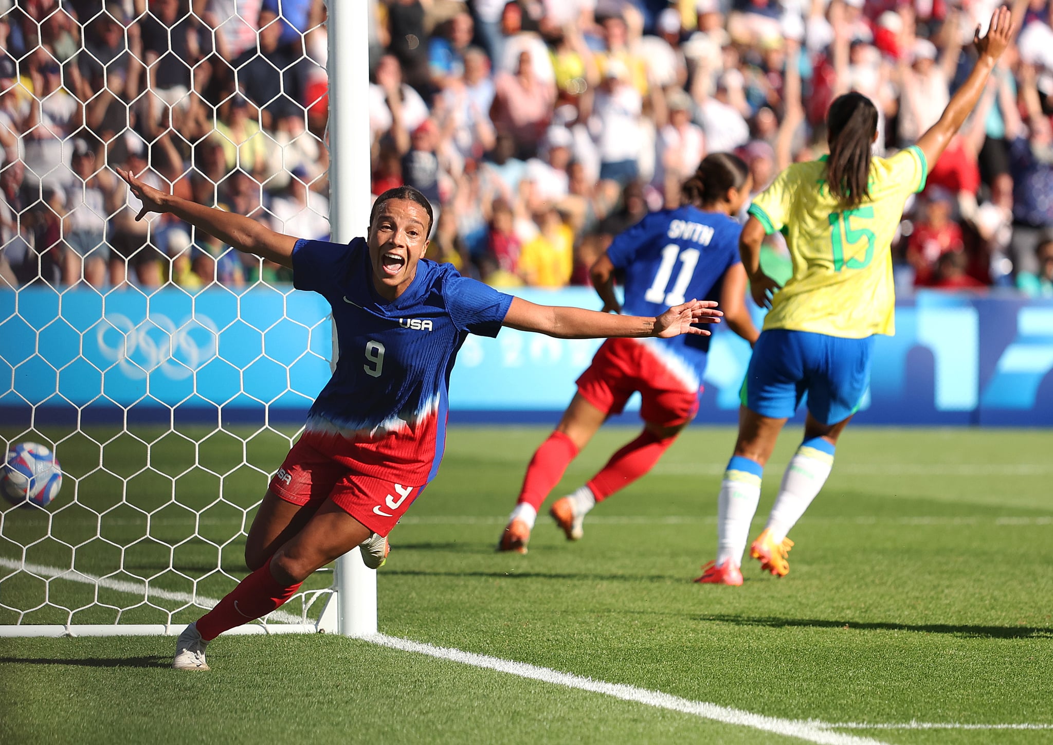 PARIS, FRANCE - AUGUST 10: Mallory Swanson #9 of Team United States celebrates scoring her team's first goal during the Women's Gold Medal match between Brazil and United States of America during the Olympic Games Paris 2024 at Parc des Princes on August 10, 2024 in Paris, France. (Photo by Julian Finney/Getty Images)
