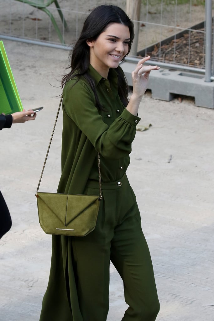 The model arrived at the Elie Saab show dressed in an army-green ensemble.