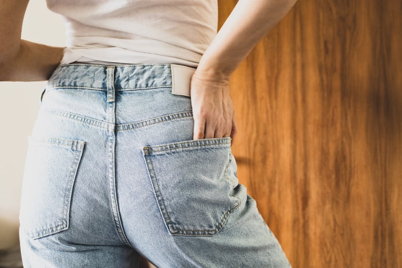 Woman Wearing Jeans With Hand In Pocket