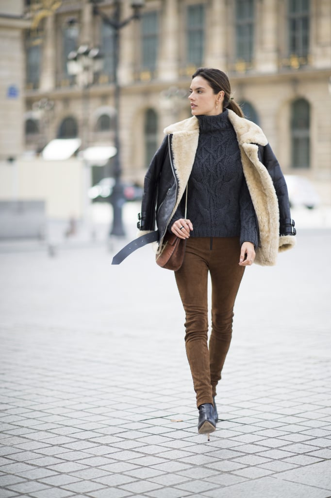 Alessandra Ambrosio wearing an Acne coat, Magda Butrym pants, Linda Farrow sunglasses, and a Chloé bag.