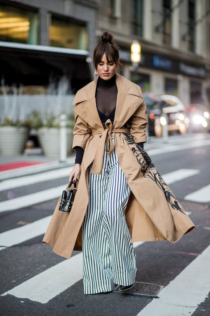 A classic trench coat tones down the effect of graphic stripes.