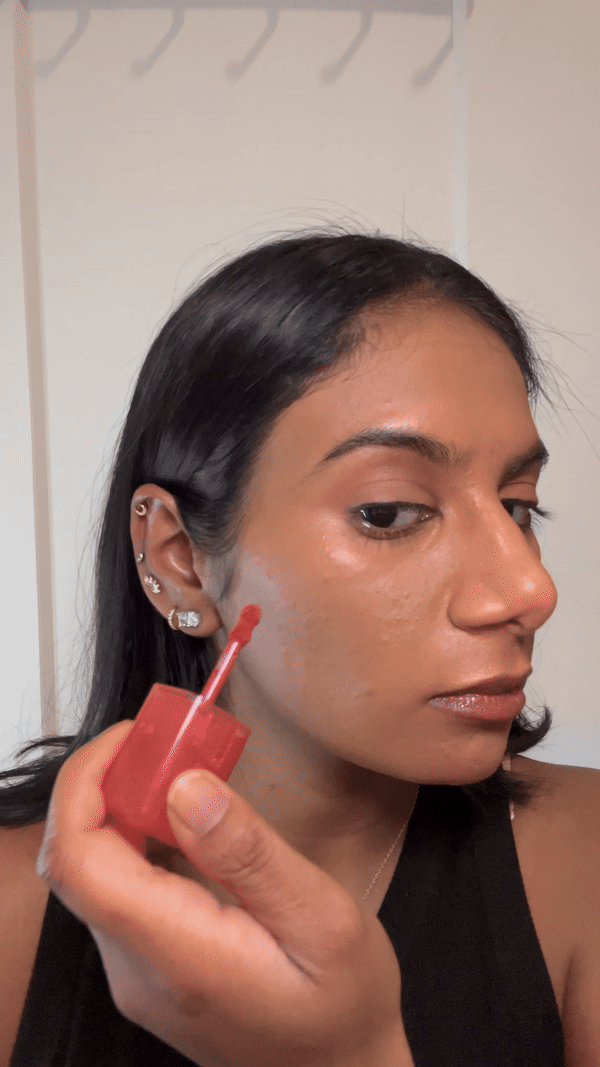 Applying the Huda Beauty Blush Filter Soft Glow Liquid Blush