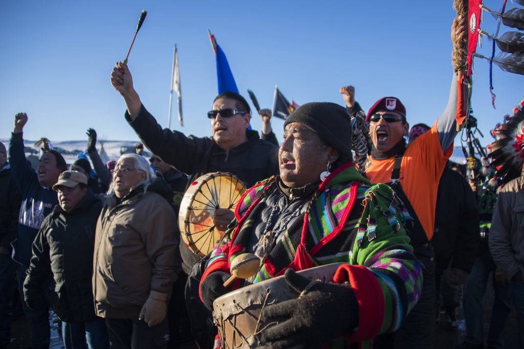 Activists play music at the reservation's Oceti Sakowin Camp.