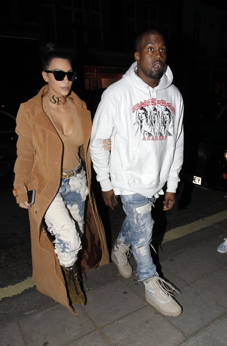 When Kim stepped out in a daring denim look — complete with a "sex" choker! —and Kayne wore a graphic white hoodie.