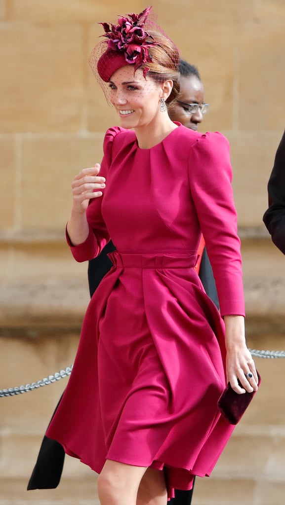 Kate wore a pink Alexander McQueen dress for Princess Eugenie's wedding. She completed her look with a hat by Philip Treacy.
