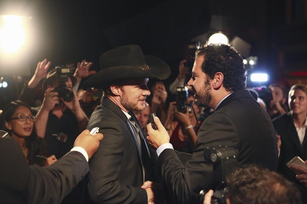 Meanwhile, Luke (Will Chase) weaves his way through the crowd.
