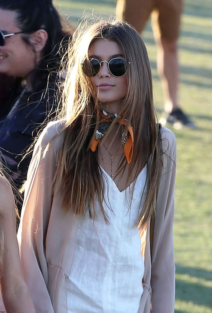 Her scarf and round shades added a retro-cool touch.