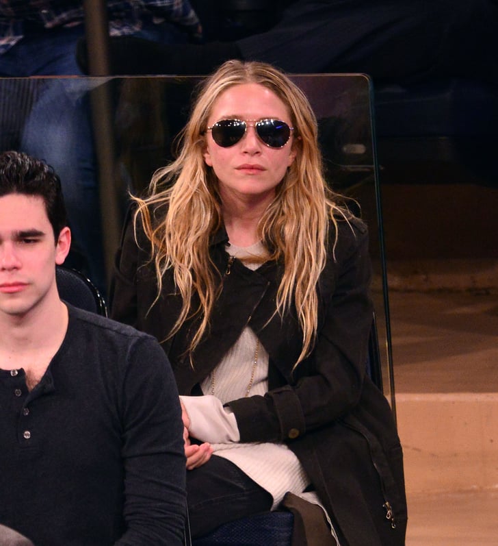 Mary-Kate Olsen also wore aviator sunglasses with a black coat while ...