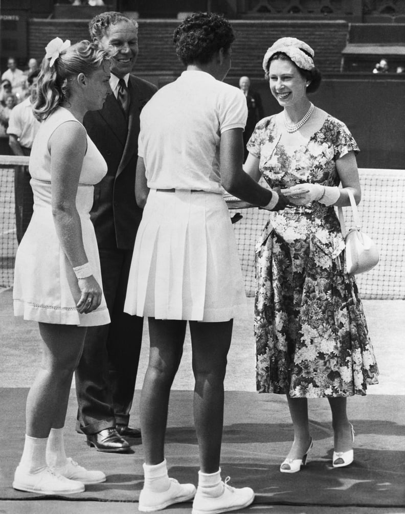 Queen Elizabeth II presents the Wimbledon trophy to Althea Gibson in 1957.