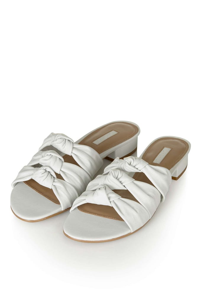 March means your toes are practically itching for a pedicure and a chance to be seen. These easy Toshop slides ($80) are like taking a first real step toward Spring.
— HWM
