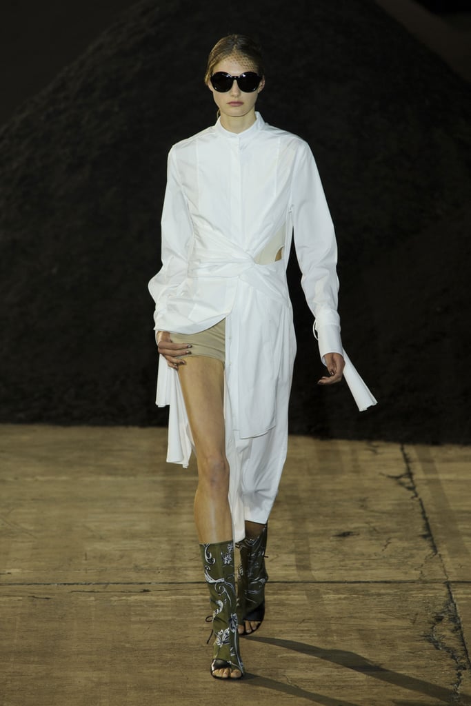 A shirtdress open over short shorts.