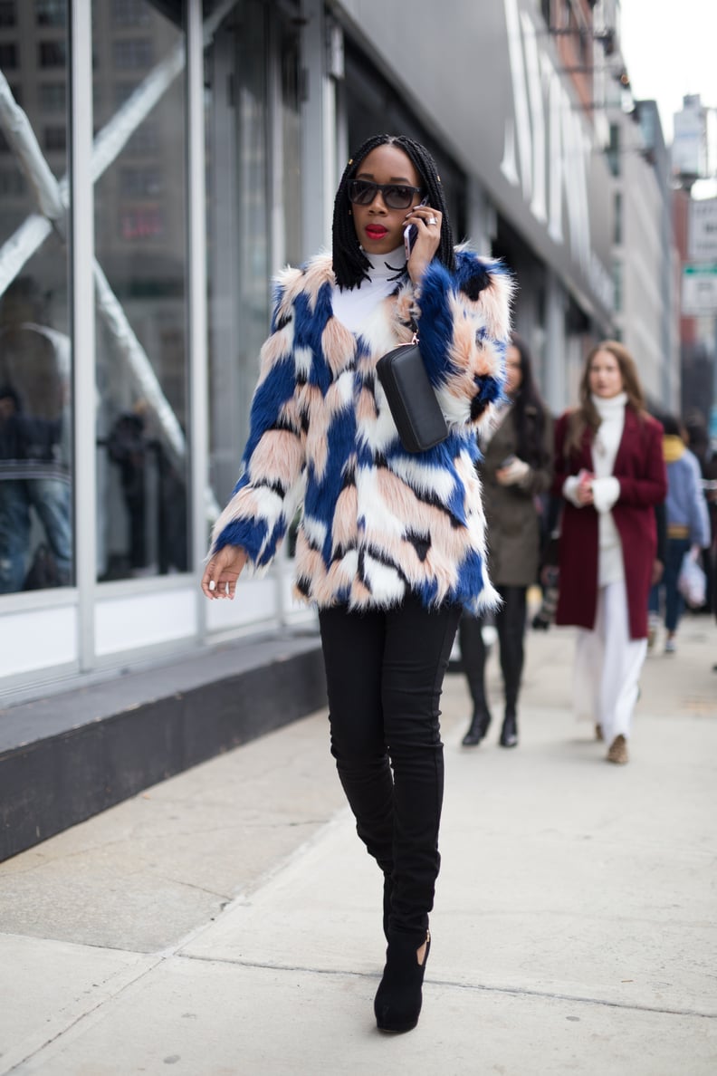 With a Bright Colored Faux-Fur Coat, a Clutch, and Black Booties