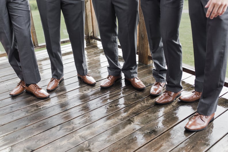 Groomsmen legs and shoes in a row