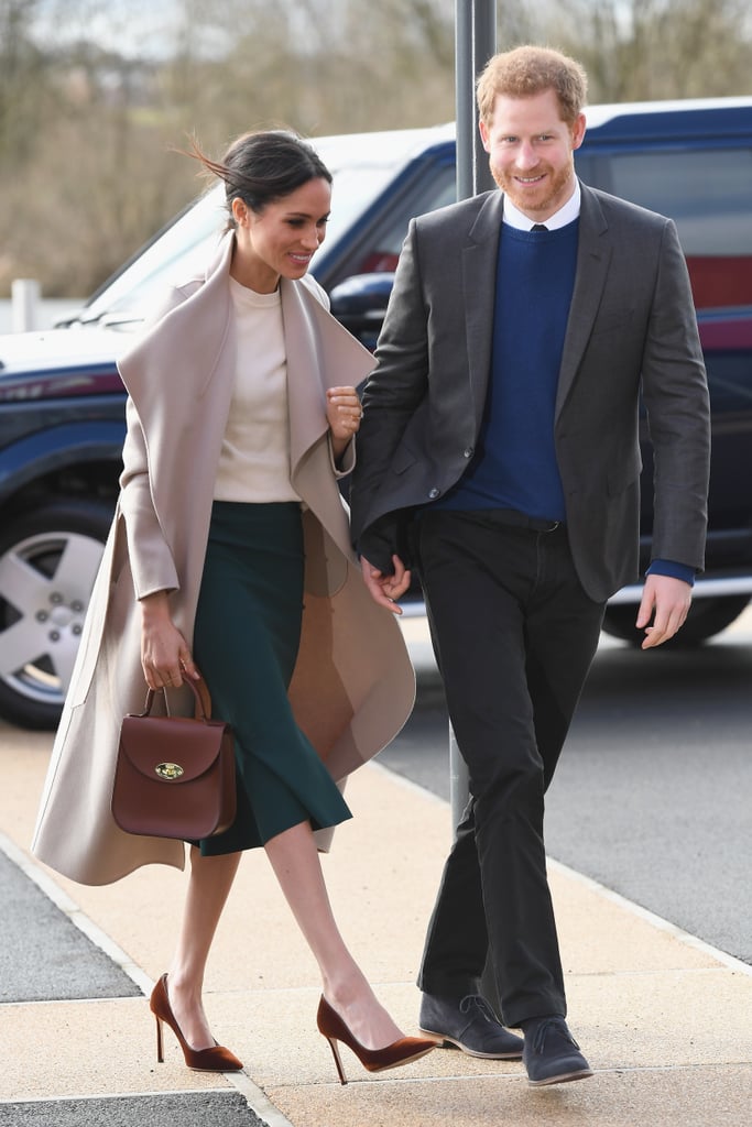 While on a visit to Belfast, Northern Ireland, the duchess wore a gorgeous Mackage coat, a Victoria Beckham jumper, a Greta Constantine skirt, and Jimmy Choo pumps. She accessorized her outfit with a Charlotte Elizabeth Bloomsbury bag and didn't wear any tights.