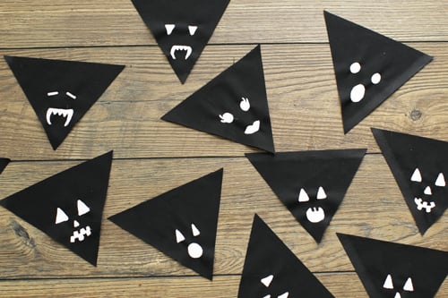 Get into the Halloween spirit with a paintbrush in hand. When I painted my Jack-O'-Lantern faces I tried to keep it simple — triangles eyes, circle mouths, square bucked teeth. All very cute, but more importantly easy to paint.