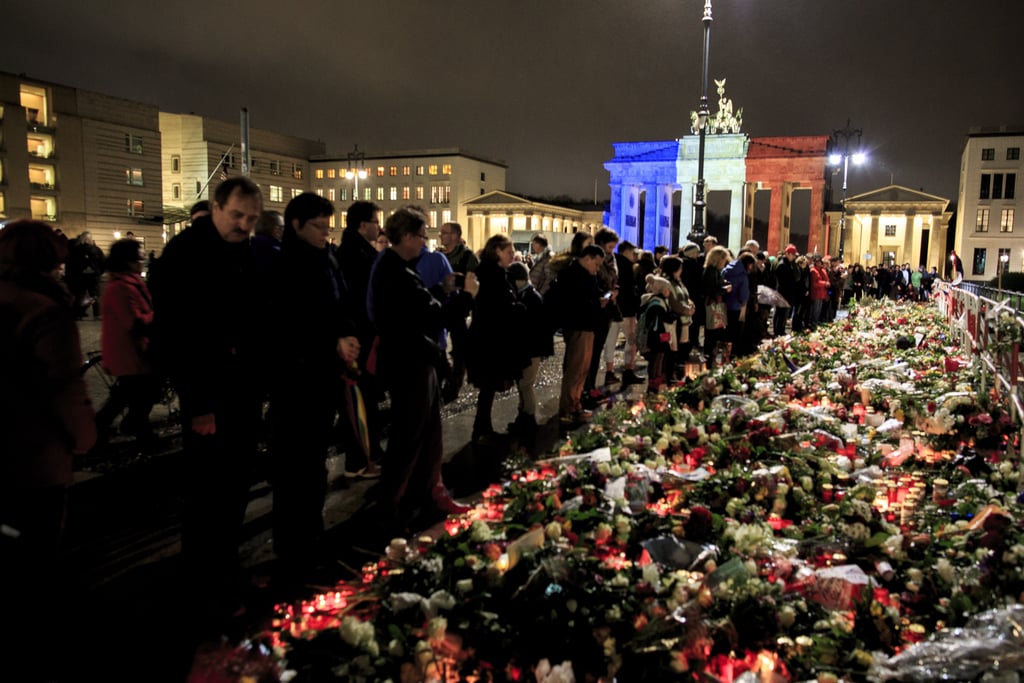 Crowds gathered in Berlin near the French embassy to pay their respects with flowers.