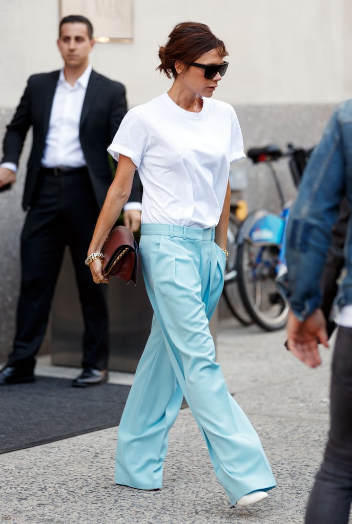 Victoria Beckham Wears White T-Shirt and Blue Pants