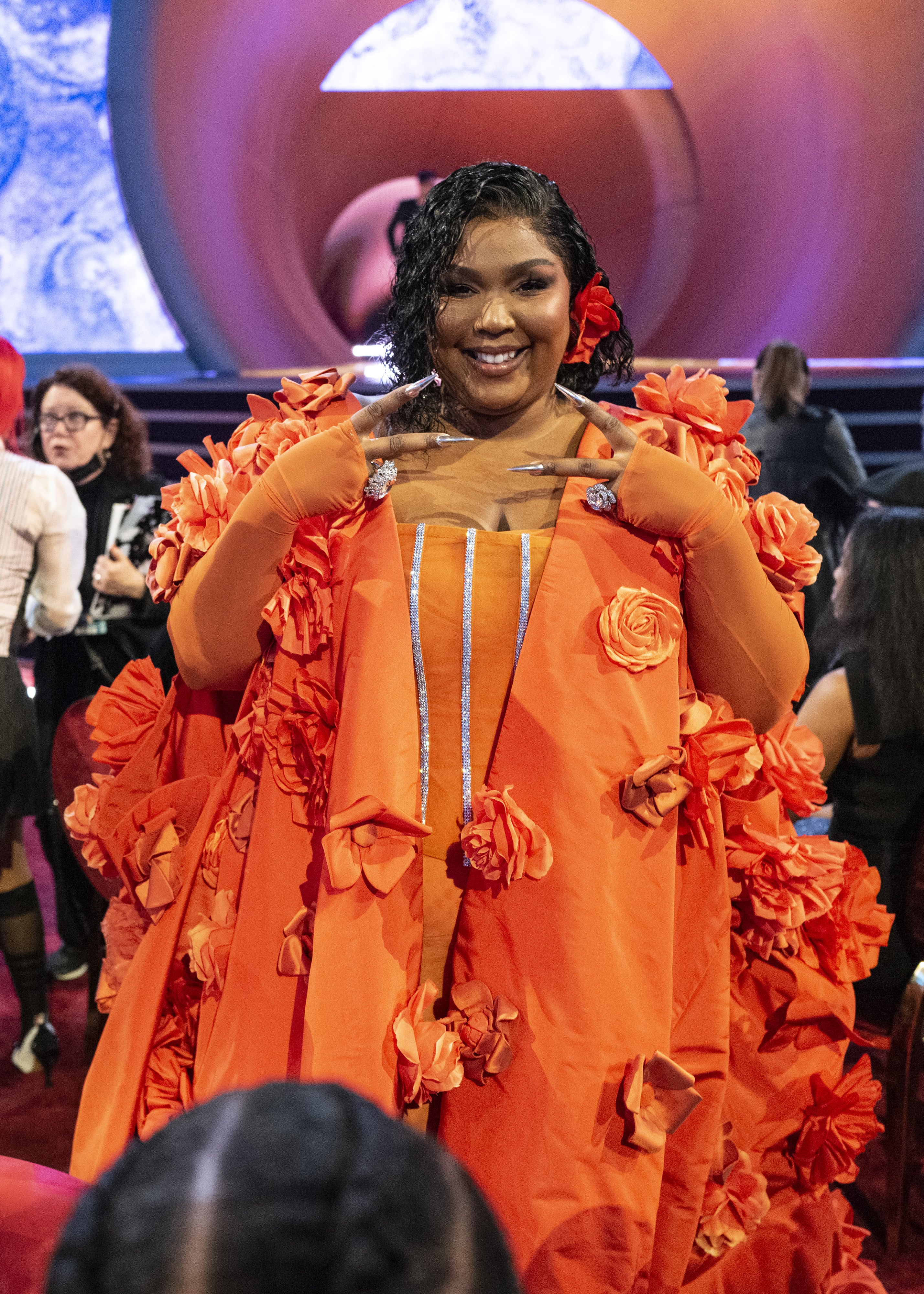 lizzo orange dress Lizzo's Floral Cape Dress at the Grammys 2023 | Photos
