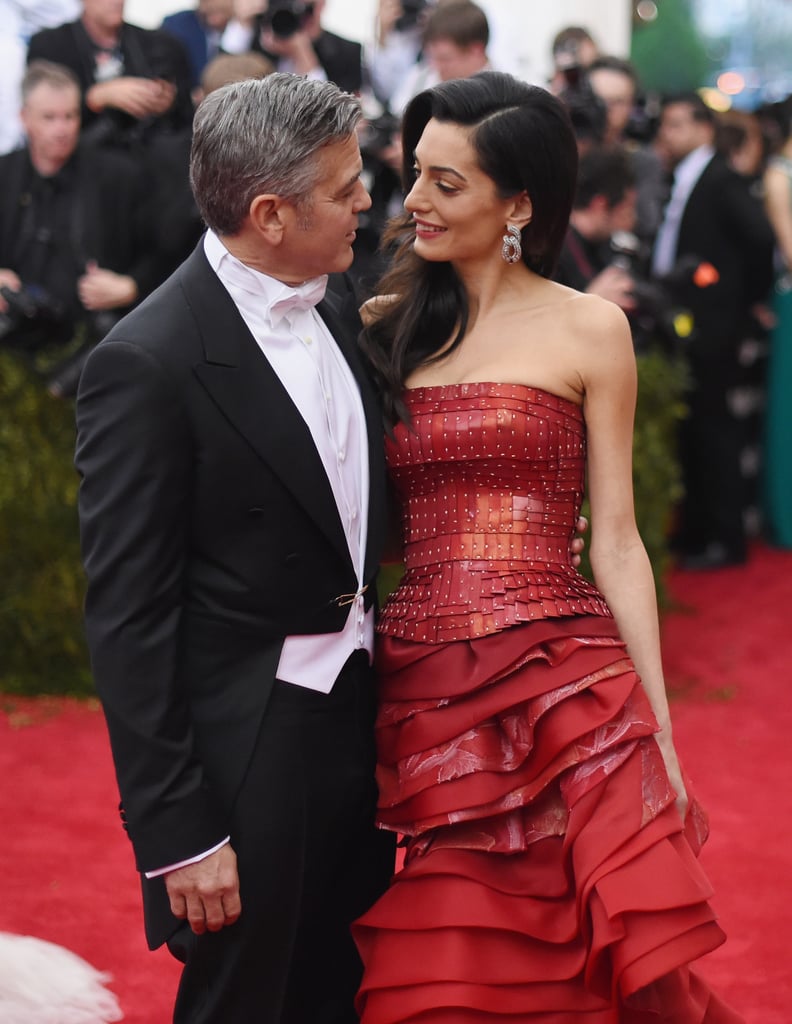 George on becoming a father: "The first thing you think is, 'I hope I don't screw this up.' I mean, look, we are all responsible for things in life, and Amal and I are responsible for each other in a way — we look out for one another and we care about one another. But you are really responsible for two kids. I want them to be happy. I want them to have a sense of humor. I want them to be interested in things. I want them to be compassionate about other people's plights. Because that's the thing, you know? You have to have some sort of empathy."
Amal on the advice she'll give to her children: "Don’t be competitive."
George on Amal being his life partner: "Every single day of my life, I just feel lucky. Lucky in my career. Lucky enough to have found the perfect partner. Sometimes in life it doesn't happen on your schedule, but you find the person that you were always supposed to be with. That's how I feel, and I know that's how Amal feels."