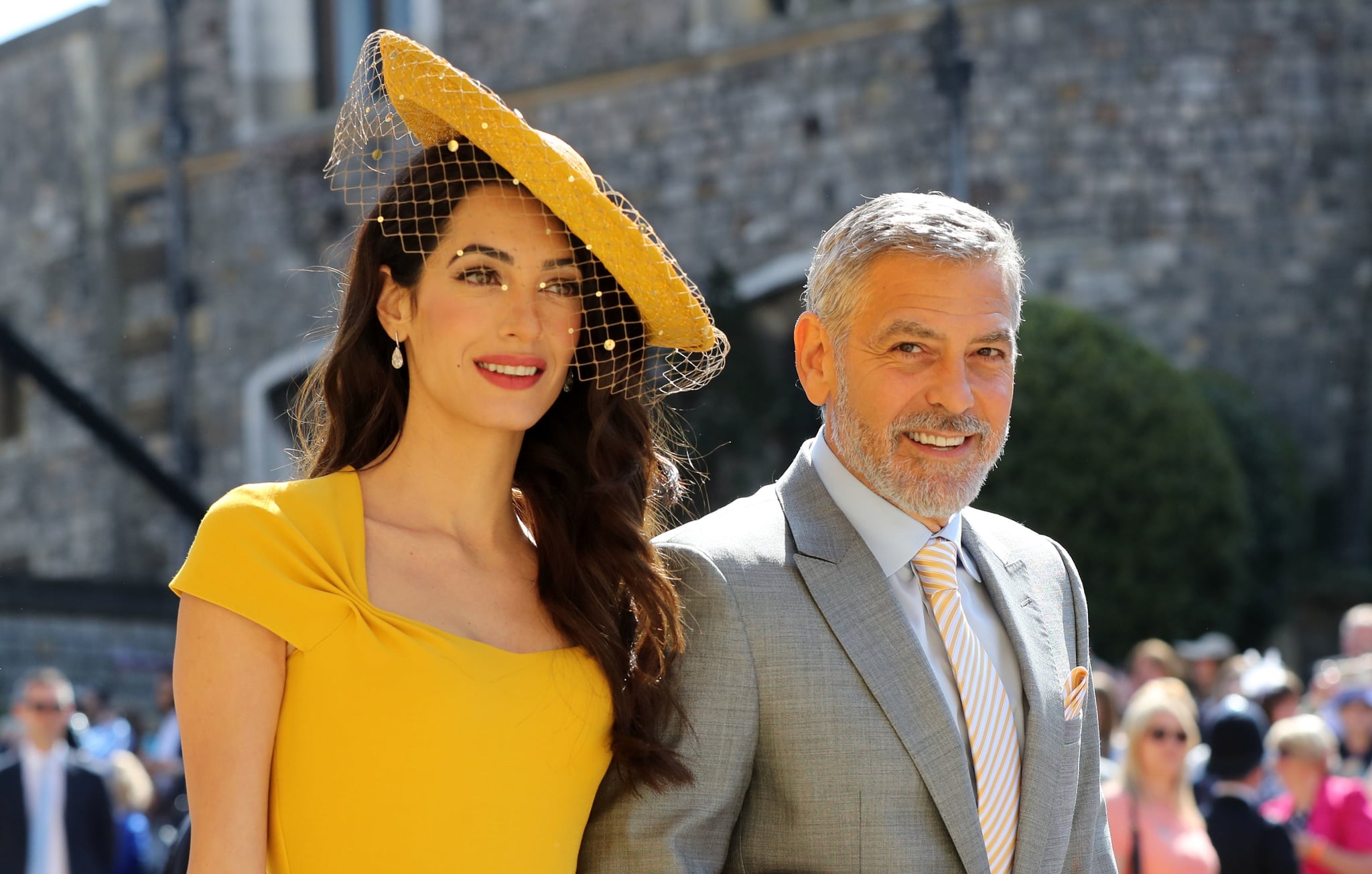 WINDSOR, UNITED KINGDOM - MAY 19:  Amal Clooney and George Clooney arrive at St George's Chapel at Windsor Castle before the wedding of Prince Harry to Meghan Markle on May 19, 2018 in Windsor, England. (Photo by Gareth Fuller - WPA Pool/Getty Images)