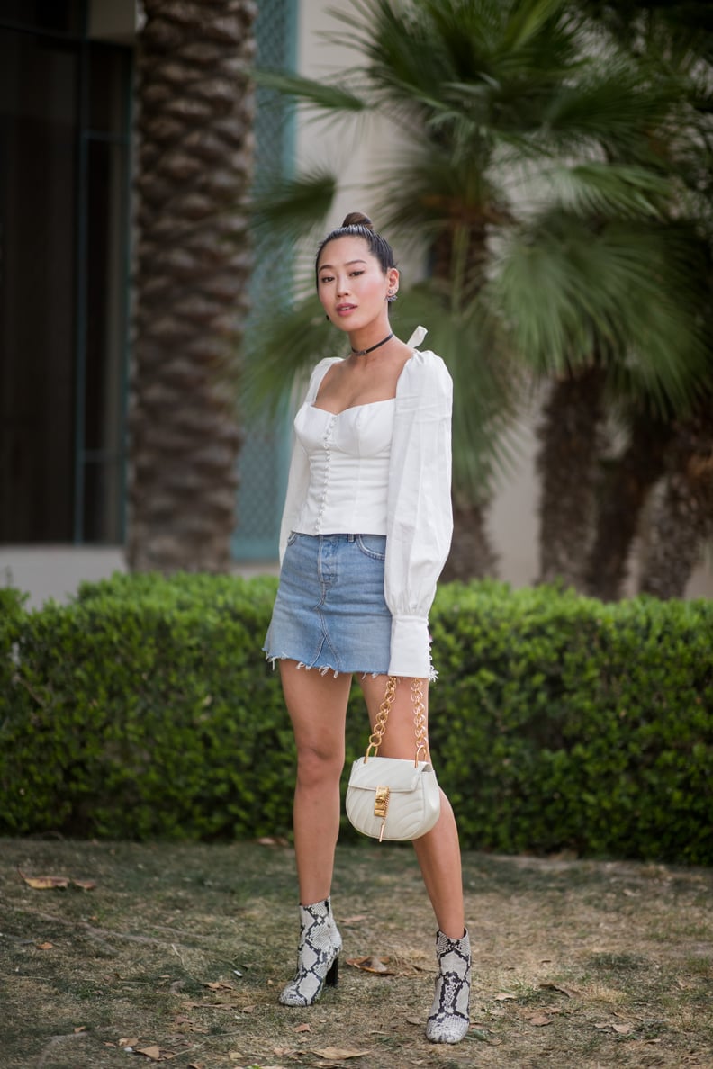 Dress Up a Laid-Back Denim Skirt With a Corset Blouse