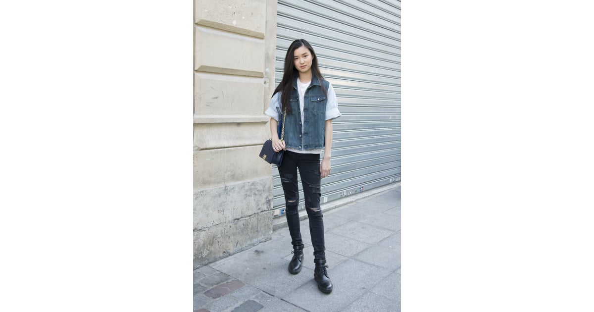 A Denim Vest and Distressed Black Jeans How to Wear Denim on Denim