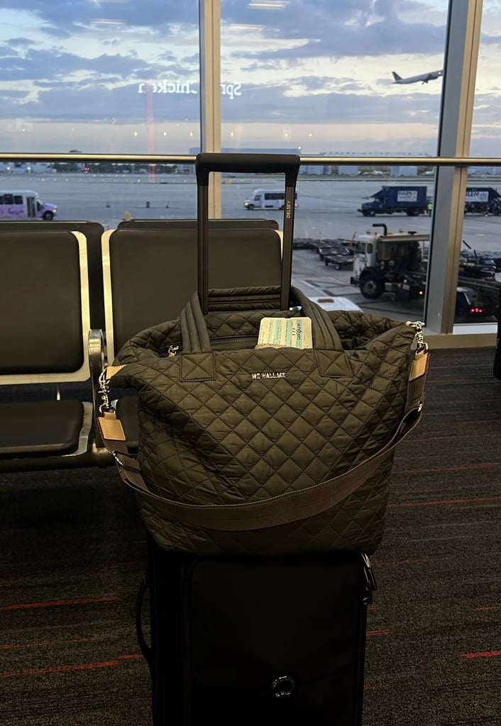 MZ Wallace Medium Metro Deluxe Tote ($275)
I once described this as my "Mary Poppins-esque bag" in a review of the MZ Wallace Tote, and I stand by that description. With 11 separate compartments, it's remarkable just how much I can actually squeeze into this travel bag. Not only does it fit seamlessly under airplane seats, but it's also easy to store in overhead bins on trains (including London railways).
Editor Quote: "Beyond its practicality, I also can't get over just how stylish this travel tote is. It's not quite as clunky as other personal carry-on items, but it also doesn't skimp on any interior carrying space. Best of all, the accessory's straps are incredibly comfortable. No matter how much I squeeze into the bag, I never feel weighed down or like it's a burden on my shoulders, mainly because the carrying straps are made from such a thoughtful, thick material." — Kyley Warren, former assistant shopping editor
