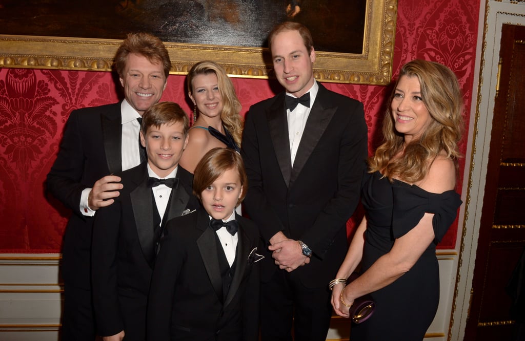 Prince William posed for photographs with Jon Bon Jovi and his family at a gala at Kensington Palace in November 2013.