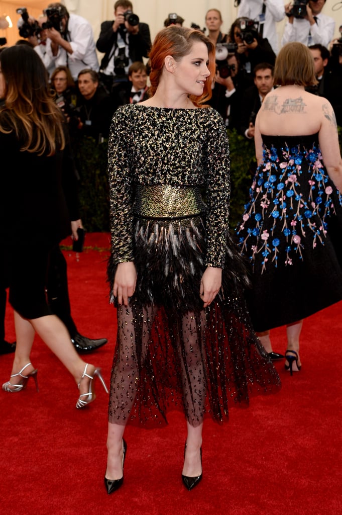 Lena Dunham's back tattoo takes up a good chunk of pixels in Kristen Stewart's side profile pic.