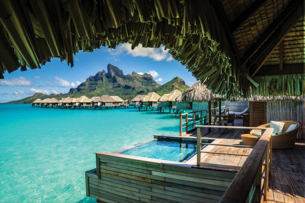 Stay at an overwater bungalow in Bora Bora.