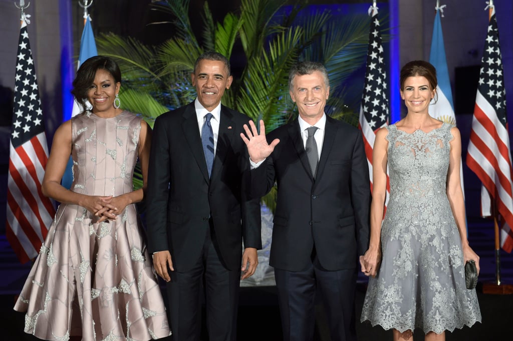Michelle played up the silver crystals on her dress with lovely hoop earrings. She was complemented by Argentine first lady Juliana Awada, who chose a gray lace number in a similar silhouette.