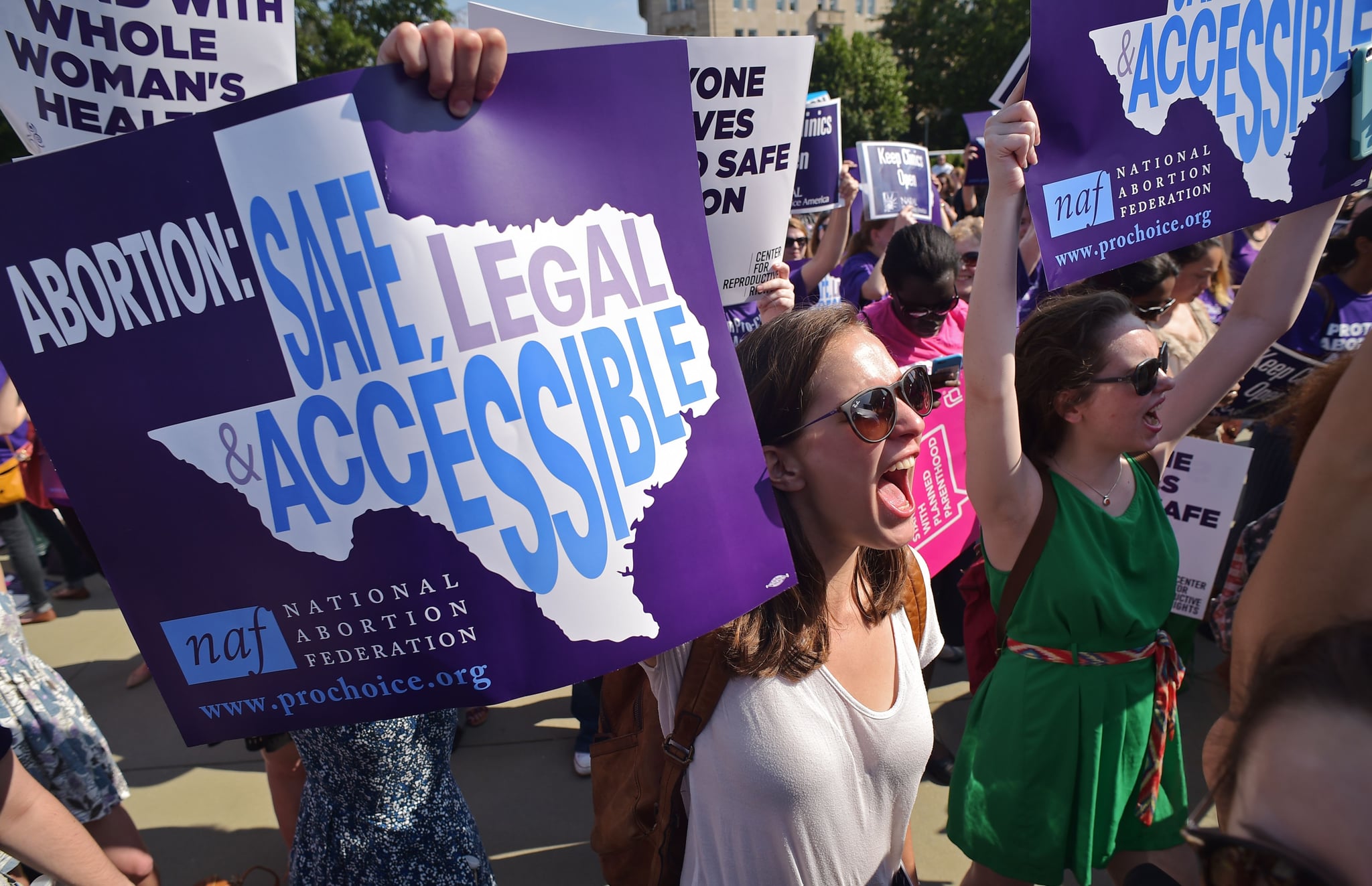 Abortion rights activists hold placards and chant outside of the US Supreme Court ahead of a ruling on abortion clinic restrictions on June 27, 2016 in Washington, DC.In a case with far-reaching implications for millions of women across the United States, the court ruled 5-3 to strike down measures which activists say have forced more than half of Texas's abortion clinics to close. / AFP / MANDEL NGAN        (Photo credit should read MANDEL NGAN/AFP via Getty Images)