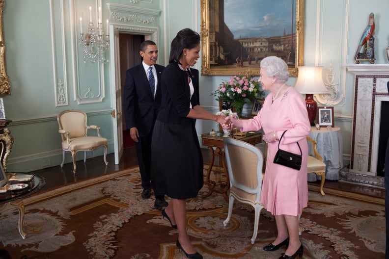 She's all smiles when she meets the queen.