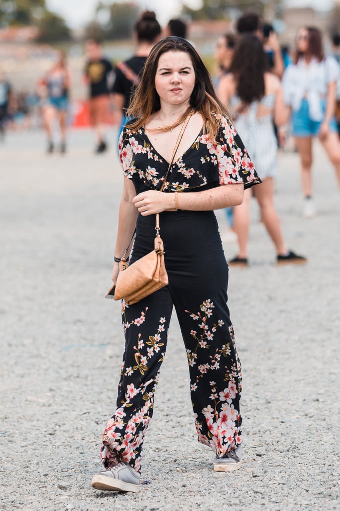 Your festival season outfit is sorted with a floral jumpsuit and casual shoes.