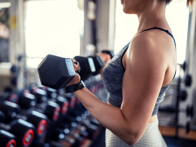 Young woman weightlifting at the gym.