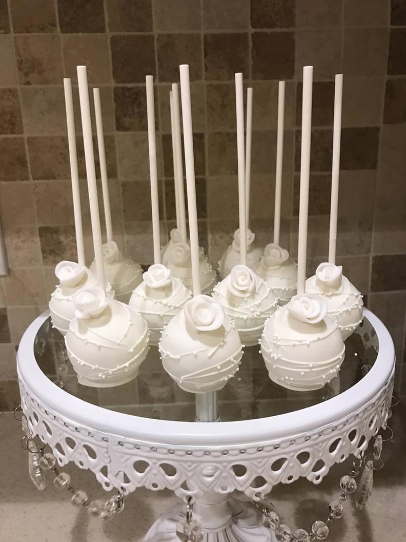 White Drizzled Cake Pops With White Sprinkles and Edible White Flower