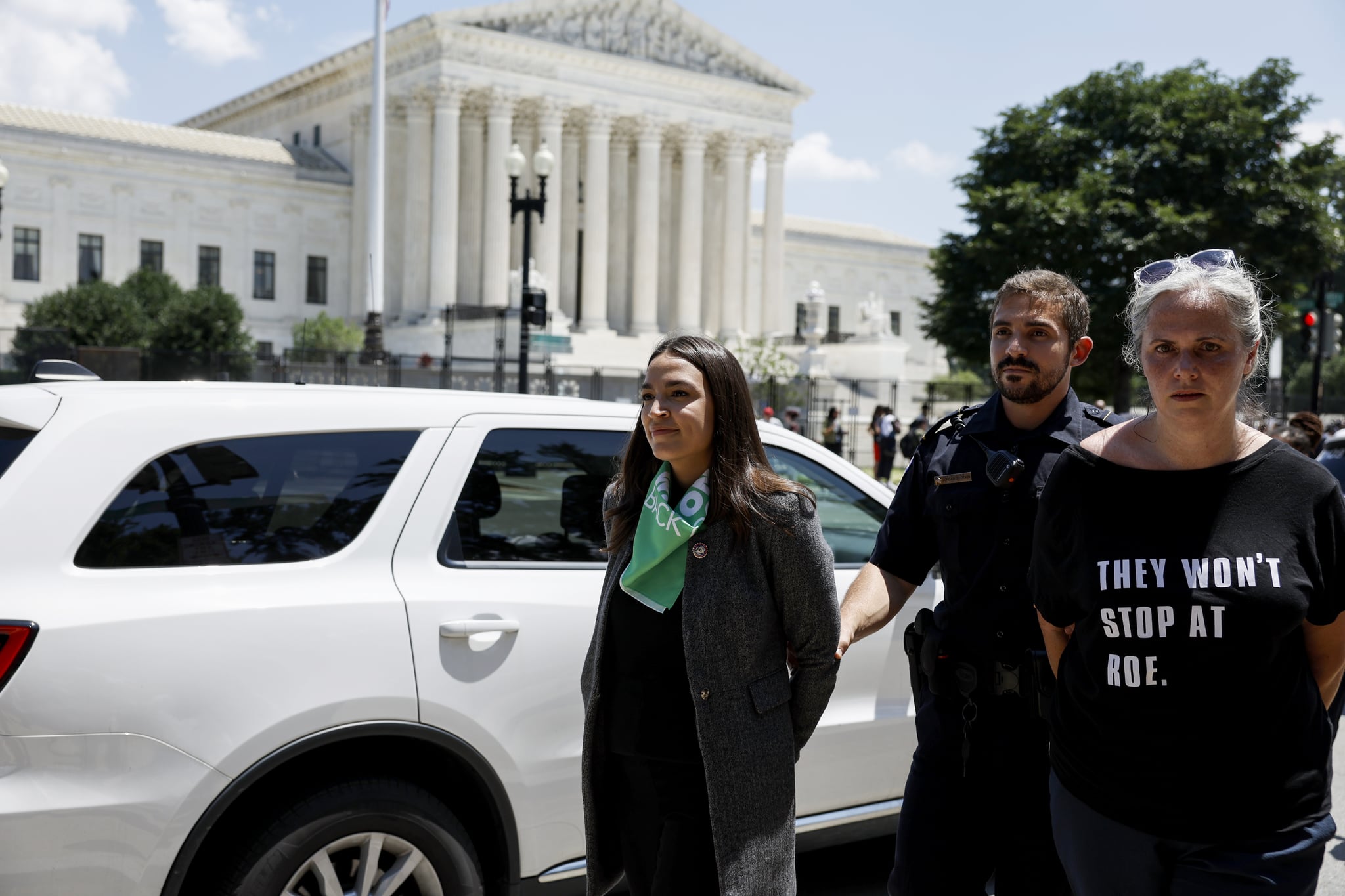 WASHINGTON, DC - JULY 19: Rep. Alexandria Ocasio-Cortez (D-NY) is detained by U.S. Capitol Police Officers after participating in a sit in with activists from Center for Popular Democracy Action (CPDA) in front of the U.S. Supreme Court Building on July 19, 2022 in Washington, DC. The CPDA held the protest with House Democrats in support of abortion rights. (Photo by Anna Moneymaker/Getty Images)