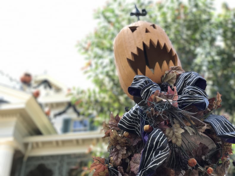 The Haunted Mansion gates are fully decked out.