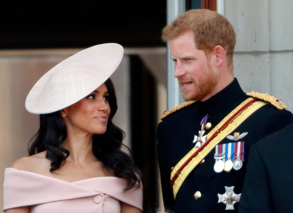 LONDON, UNITED KINGDOM - JUNE 09: (EMBARGOED FOR PUBLICATION IN UK NEWSPAPERS UNTIL 24 HOURS AFTER CREATE DATE AND TIME) Meghan, Duchess of Sussex and Prince Harry, Duke of Sussex stand on the balcony of Buckingham Palace during Trooping The Colour 2018 on June 9, 2018 in London, England. The annual ceremony involving over 1400 guardsmen and cavalry, is believed to have first been performed during the reign of King Charles II. The parade marks the official birthday of the Sovereign, even though the Queen's actual birthday is on April 21st. (Photo by Max Mumby/Indigo/Getty Images)