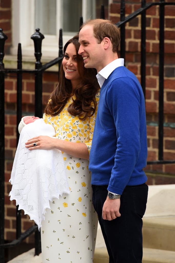 Prince William posed alongside the Duchess of Cambridge and his new daughter, Charlotte Elizabeth Diana, in a blue sweater and navy pants.