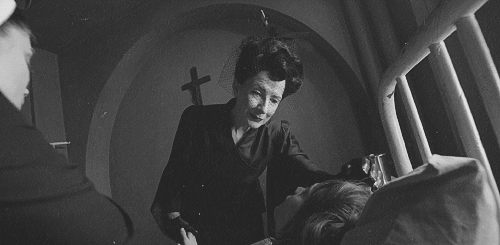 Conroy as The Angel of Death in Asylum