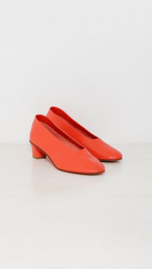 Martiniano's High Glove Pump ($580) is available in this tangy shade and features a signature Italian silhouette.