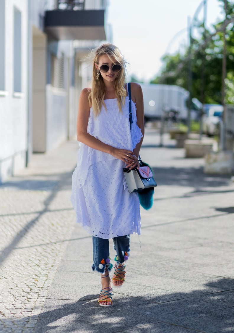 A White Dress Worn Over Jeans